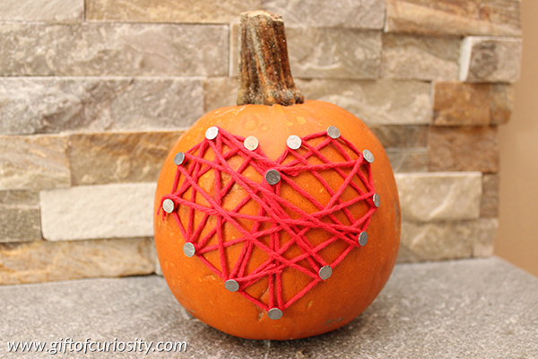 Nail and yarn decorated pumpkins for Halloween #pumpkins #Halloween || Gift of Curiosity