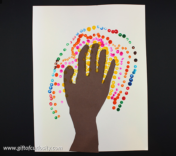 Make beautiful handprint dot trees using children's handprints to create trunks for the tree. This fine motor art project will show off children's unique hand print and creative style. | #artsandcrafts #handsonlearning #finemotor #giftofcuriosity || Gift of Curiosity