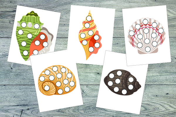 FREE Shells Do-a-Dot Printables for kids ages 2-6 | Practice one-to-one correspondence, shapes, colors, patterning, letters, and numbers | #ocean #shells #freeprintable #DoADot #giftofcuriosity